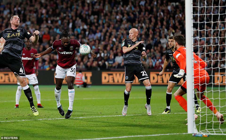 4570348-6211643-Having_come_into_the_side_Michail_Antonio_powers_home_a_header_e-a-50_1537994332349