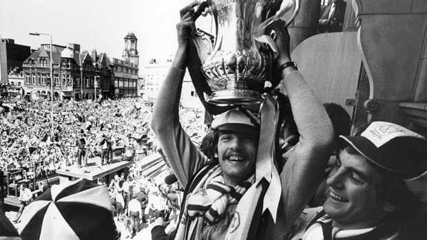 April 1980:  Alan Devonshire lifts the FA Cup over his head at a civic reception in West Ham to celebrate West Ham United's 1-0 victory over Arsenal in the FA Cup final .  (Photo by Evening Standard/Getty Images)